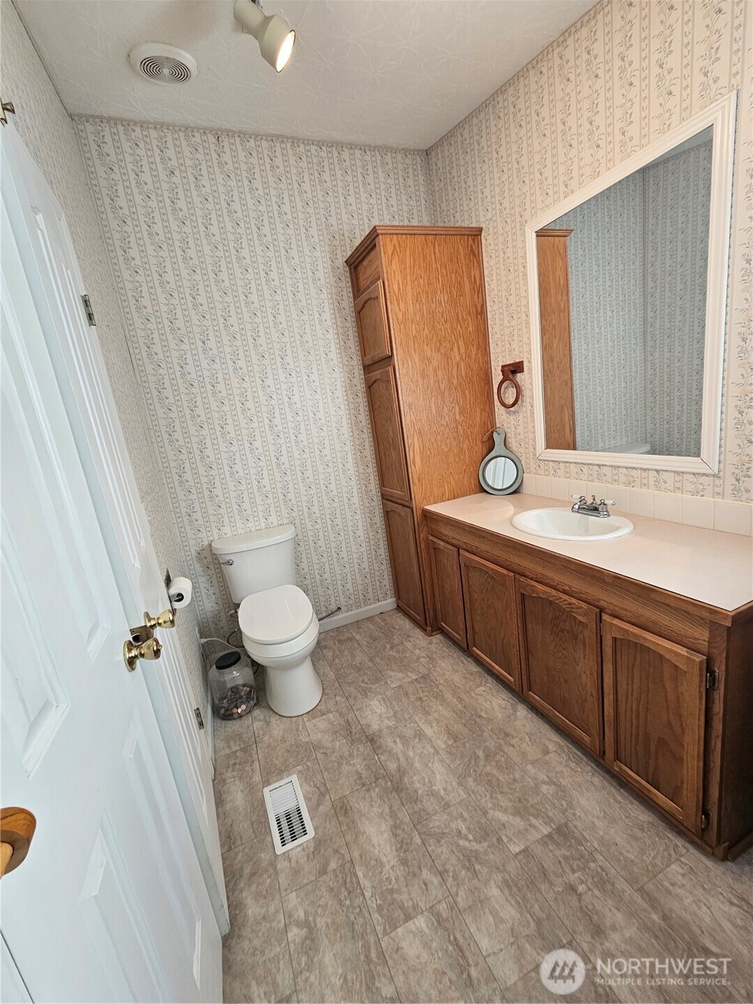 2004 195th Street Long Beach, WA 98631 - Photo 22 of 34 a spacious bathroom with a double vanity sink toilet mirror and shower