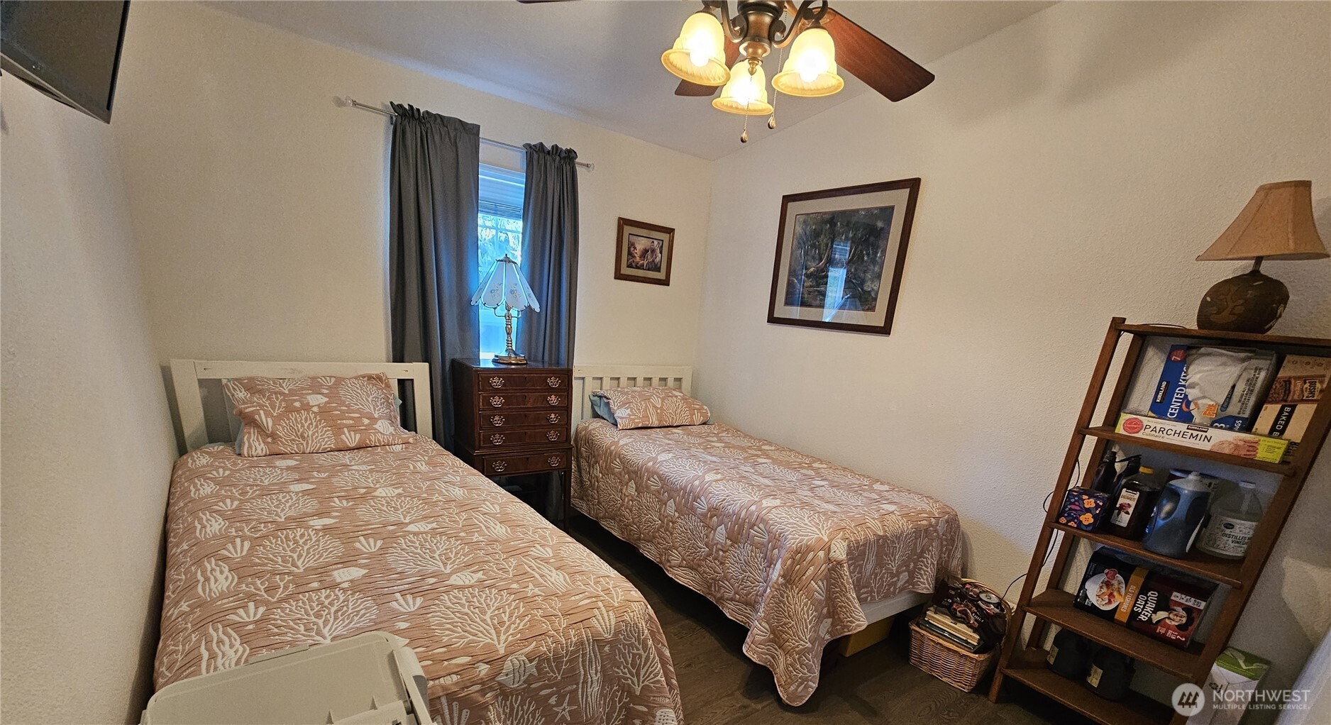 2004 195th Street Long Beach, WA 98631 - Photo 25 of 34 a bedroom with a bed and a chandelier