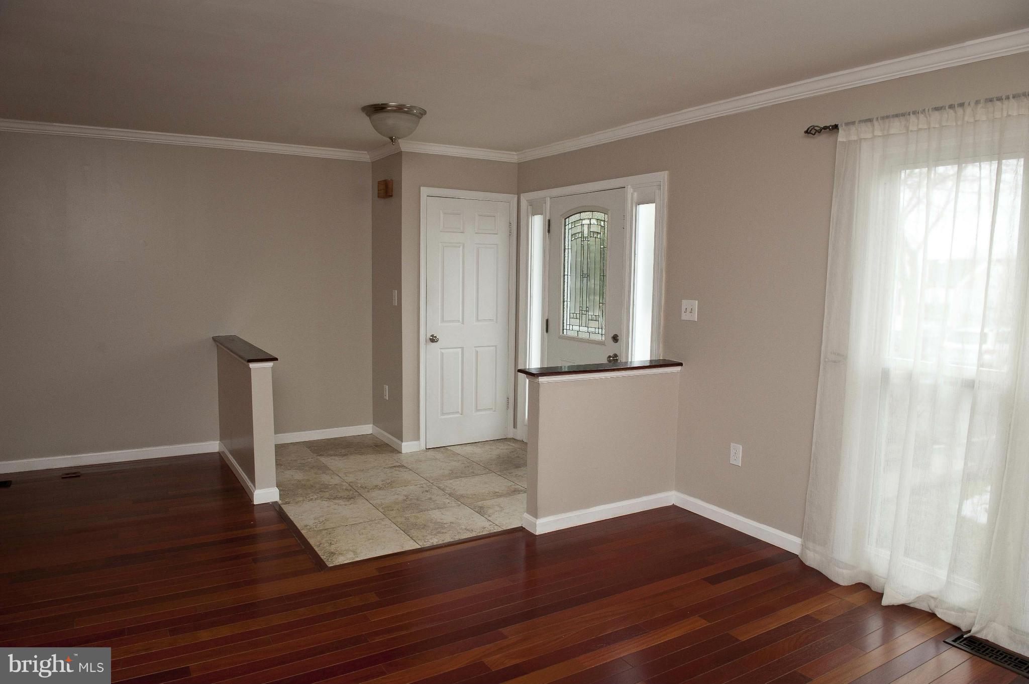 13232 Country Ridge Drive Germantown, MD 20874 - Photo 11 of 30 a view of empty room with wooden floor and fan