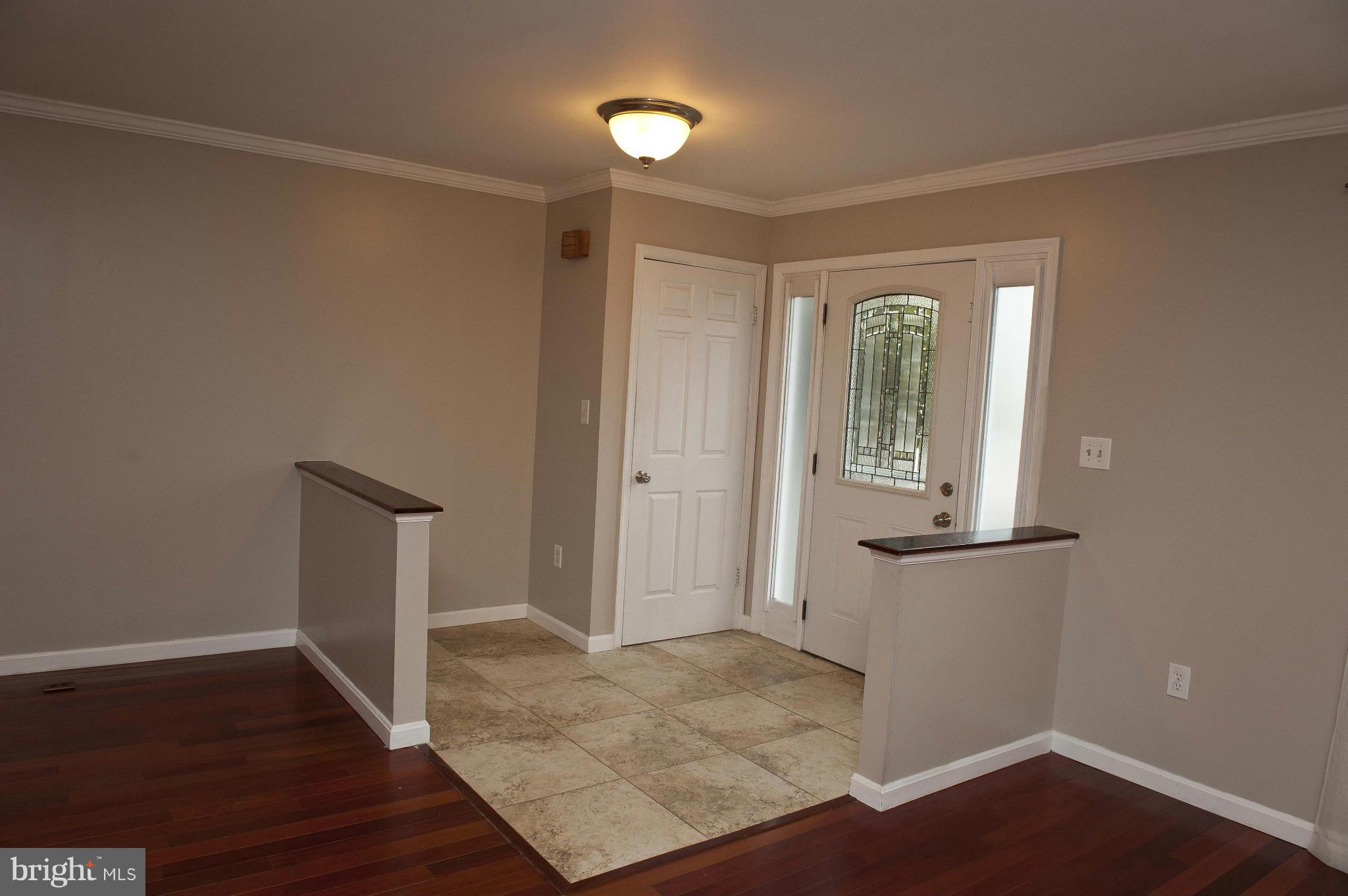 13232 Country Ridge Drive Germantown, MD 20874 - Photo 14 of 30 an empty room with wooden floor and windows