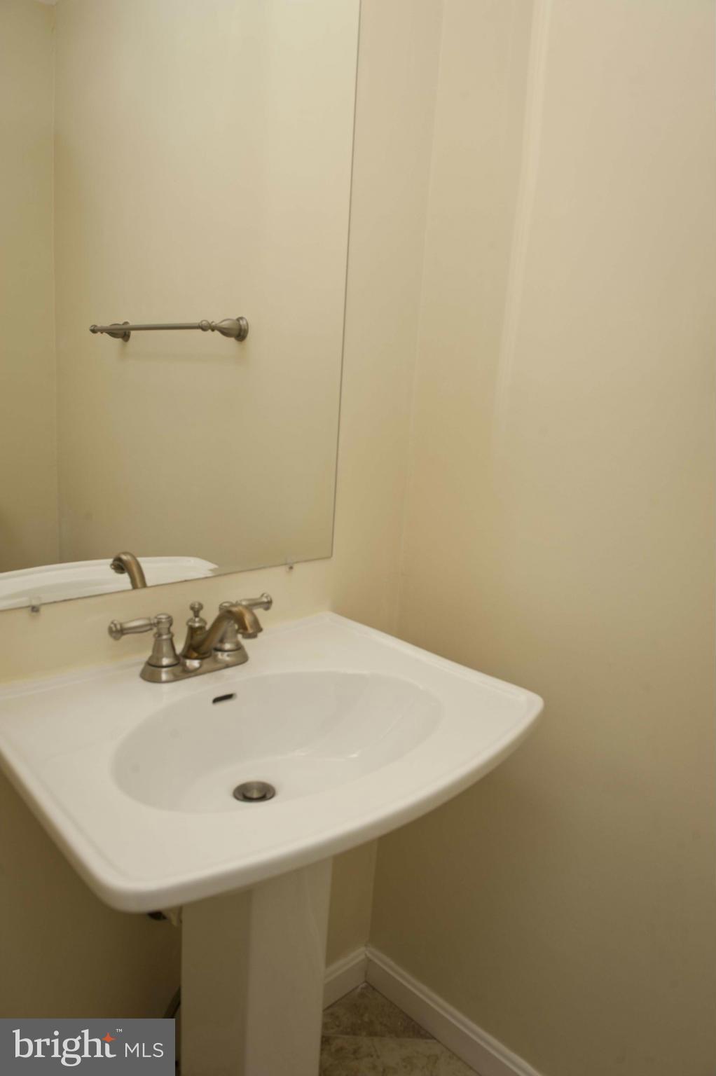 13232 Country Ridge Drive Germantown, MD 20874 - Photo 15 of 30 a bathroom with a sink and a mirror