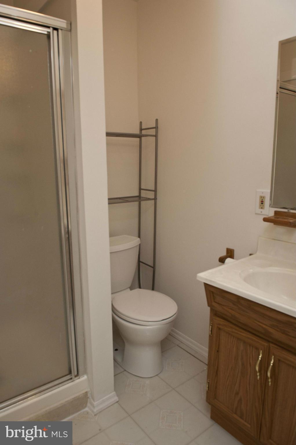 13232 Country Ridge Drive Germantown, MD 20874 - Photo 24 of 30 a bathroom with a sink toilet and a mirror