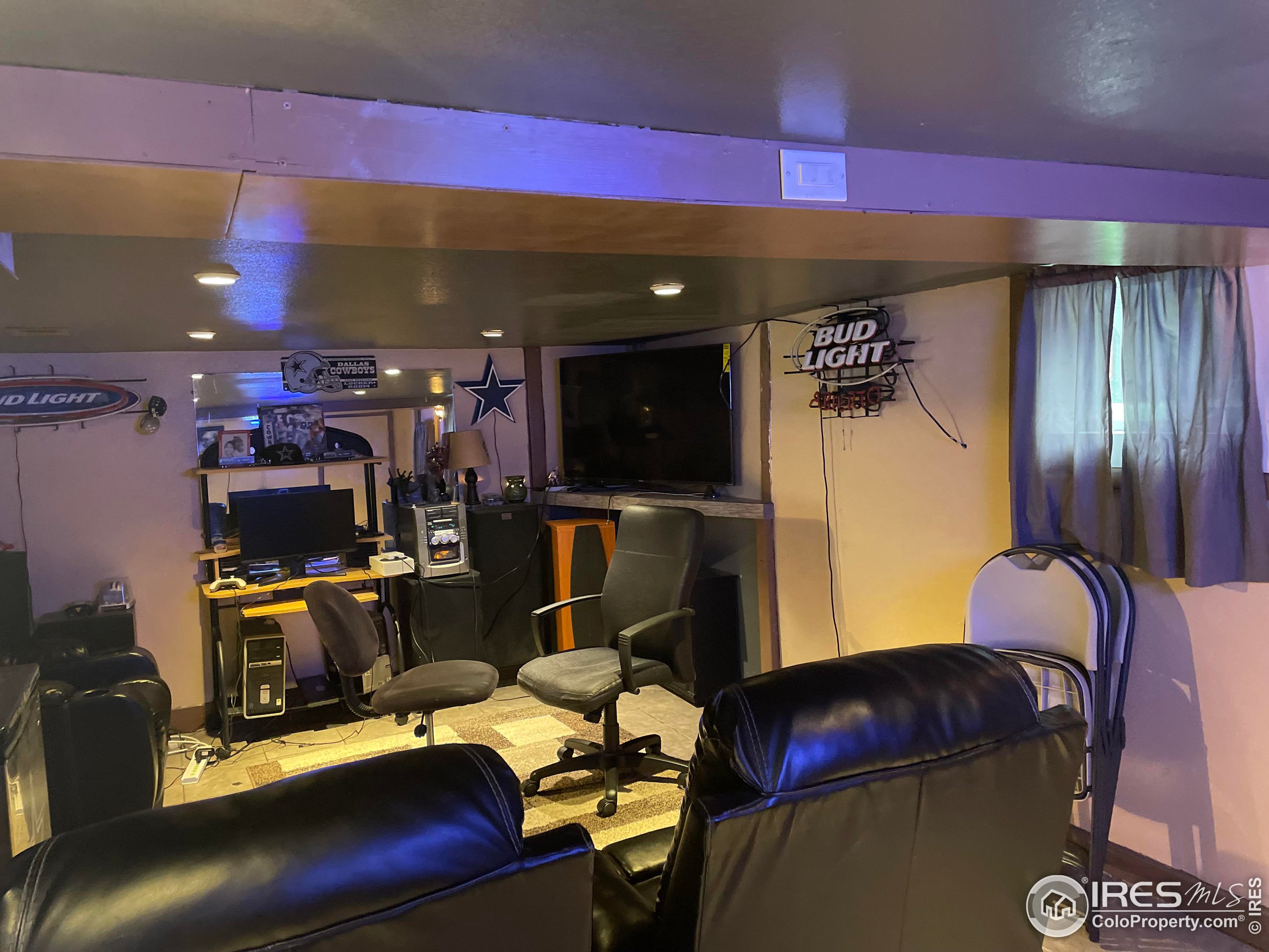 1004 1st Street Greeley, CO 80631 - Photo 20 of 27 a room with furniture and musical instruments