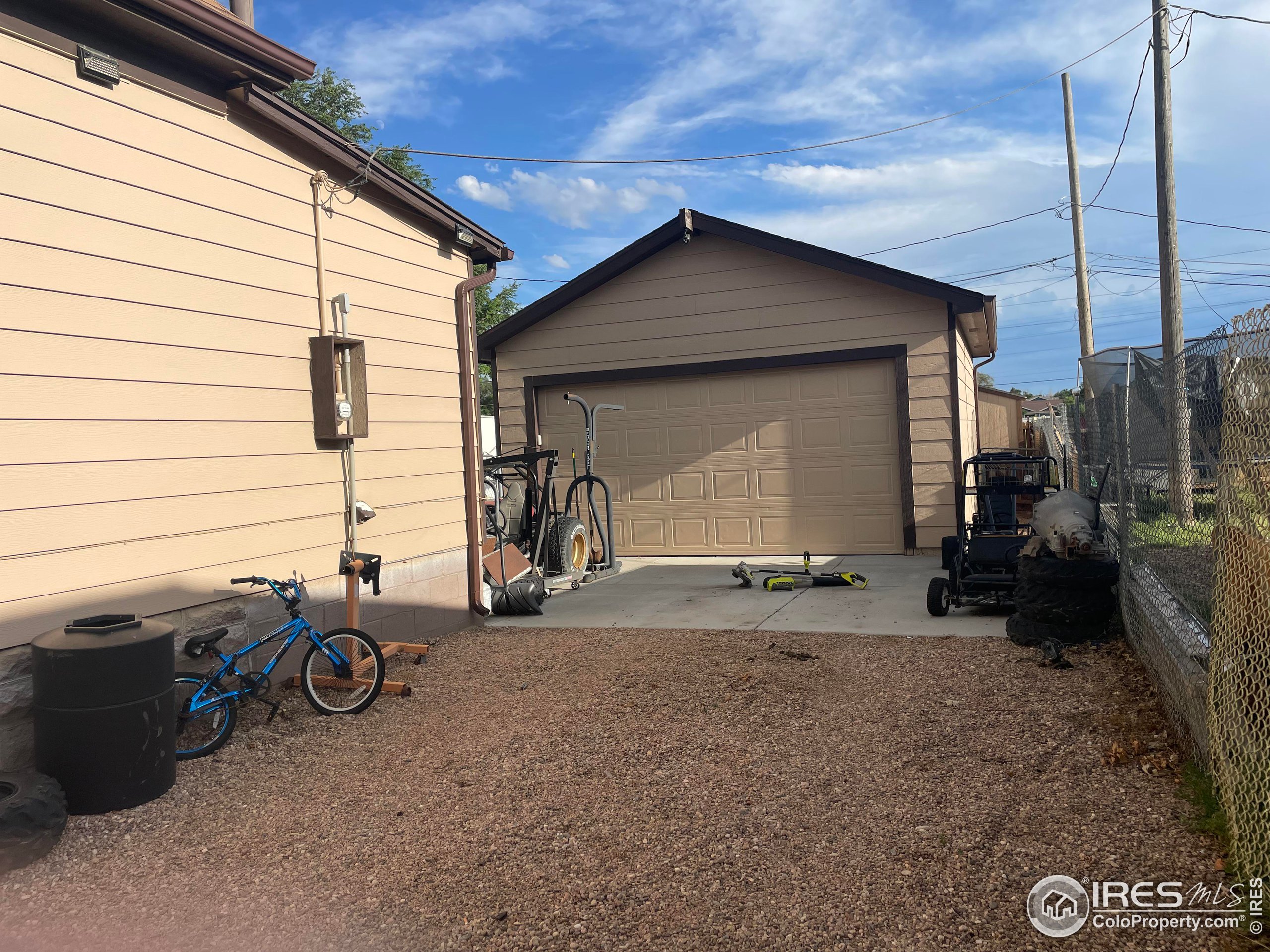 1004 1st Street Greeley, CO 80631 - Photo 3 of 27 a backyard of a house with barbeque oven table and chairs