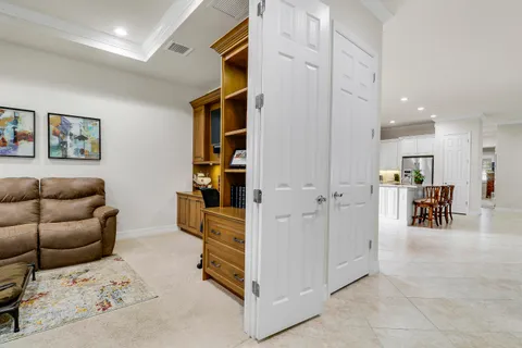 a bedroom with a bed and a desk