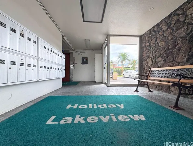 a view of a room with furniture and a rug