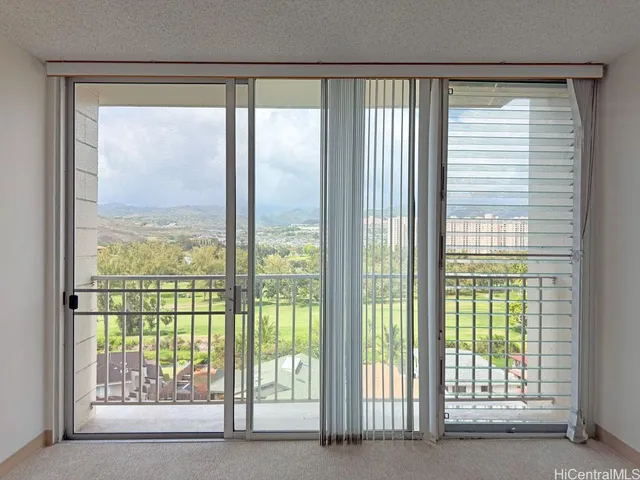 a view of a room that has a large window