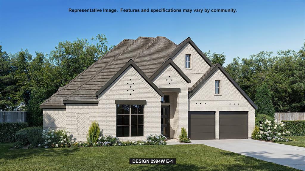 904 River Sky Road Lavon, TX 75166 - Photo 1 of 15 a front view of a house with a yard and garage