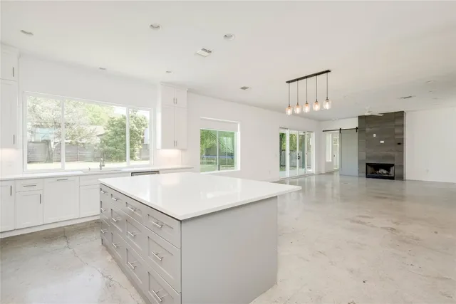 a kitchen with stainless steel appliances a stove sink and cabinets