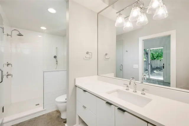 a view of storage and utility room with washer and dryer