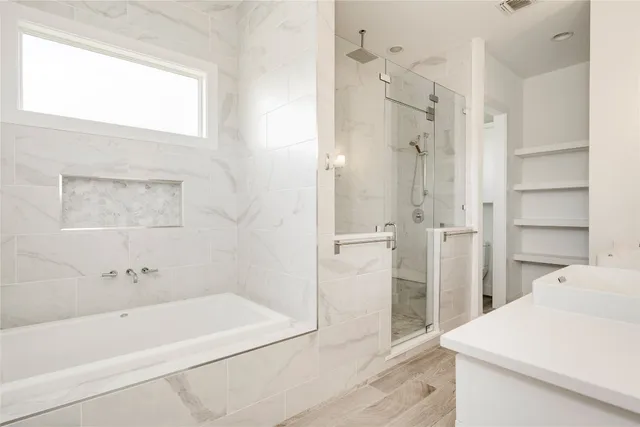 a bathroom with a double vanity sink mirror and double