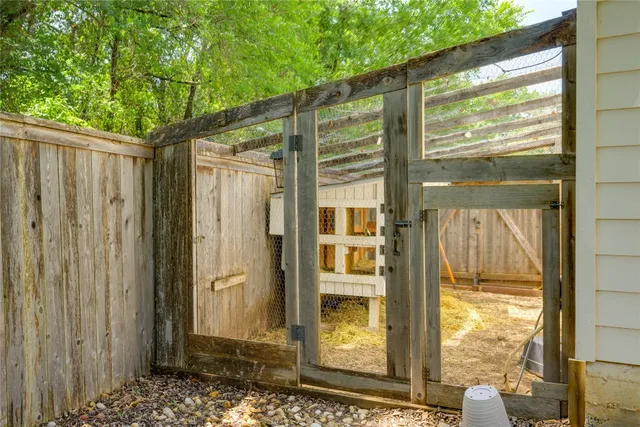 a front view of house with a garden