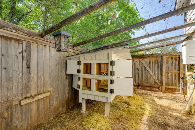 a view of a pool table and chairs in the patio