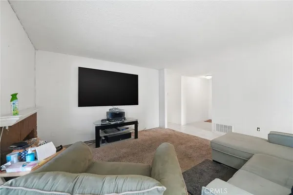 a kitchen with stainless steel appliances granite countertop a sink a stove top oven a counter space and cabinets