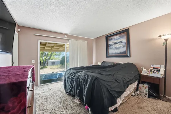 a bedroom with a bed and a view of bathroom