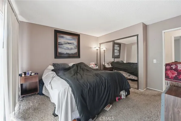 a bedroom with a workspace