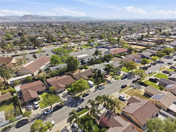 an aerial view of residential houses with outdoor space