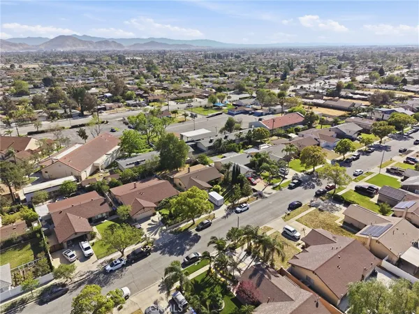 an aerial view of residential houses with outdoor space
