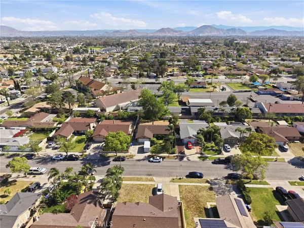 an aerial view of residential houses with outdoor space