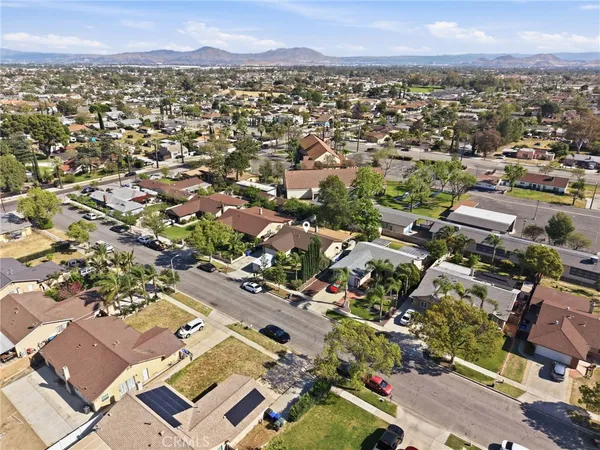 an aerial view of residential houses with outdoor space