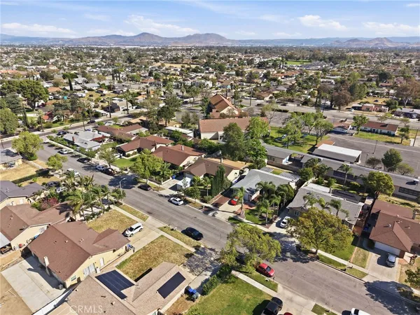 an aerial view of residential houses with outdoor space