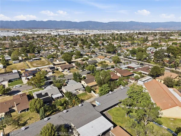 an aerial view of residential houses with outdoor space