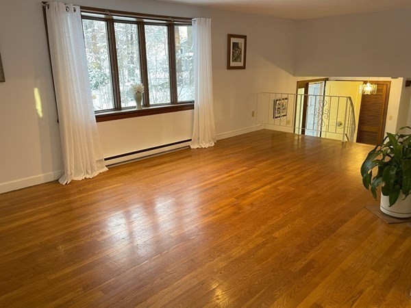 64 James Road Hanover, MA 02339 - Photo 13 of 40 a view of a livingroom with wooden floor and furniture