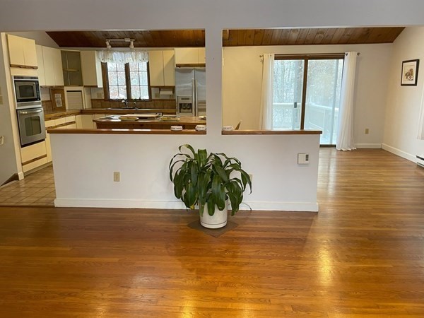 64 James Road Hanover, MA 02339 - Photo 14 of 40 a view of kitchen with stainless steel appliances granite countertop a stove a sink and a microwave