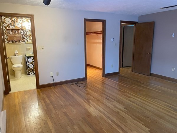 64 James Road Hanover, MA 02339 - Photo 20 of 40 a view of an empty room with wooden floor and a window