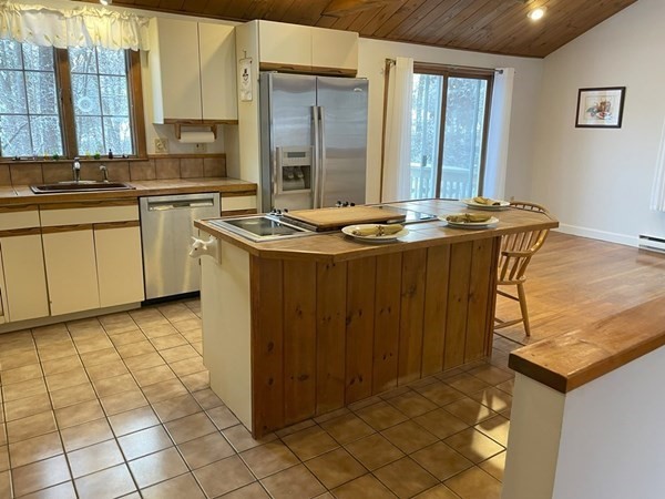 64 James Road Hanover, MA 02339 - Photo 8 of 40 a view of a kitchen with a sink and cabinets