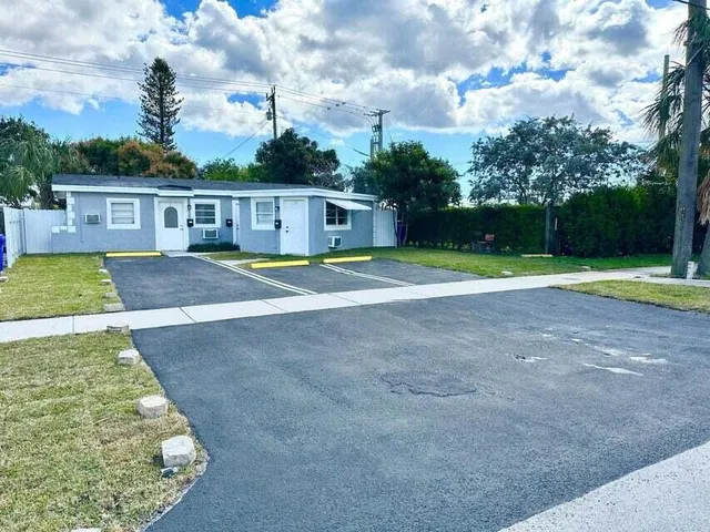 a view of outdoor space with playground and green space