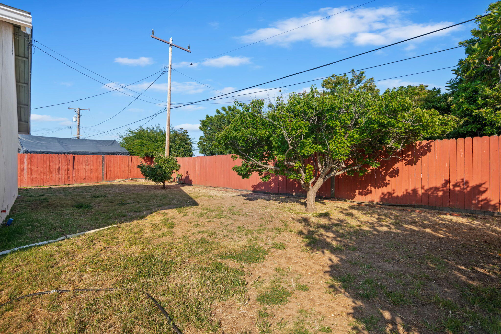 52 Deerhurst Drive Goleta, CA 93117 - Photo 17 of 18 a backyard of a house with a yard and outdoor seating