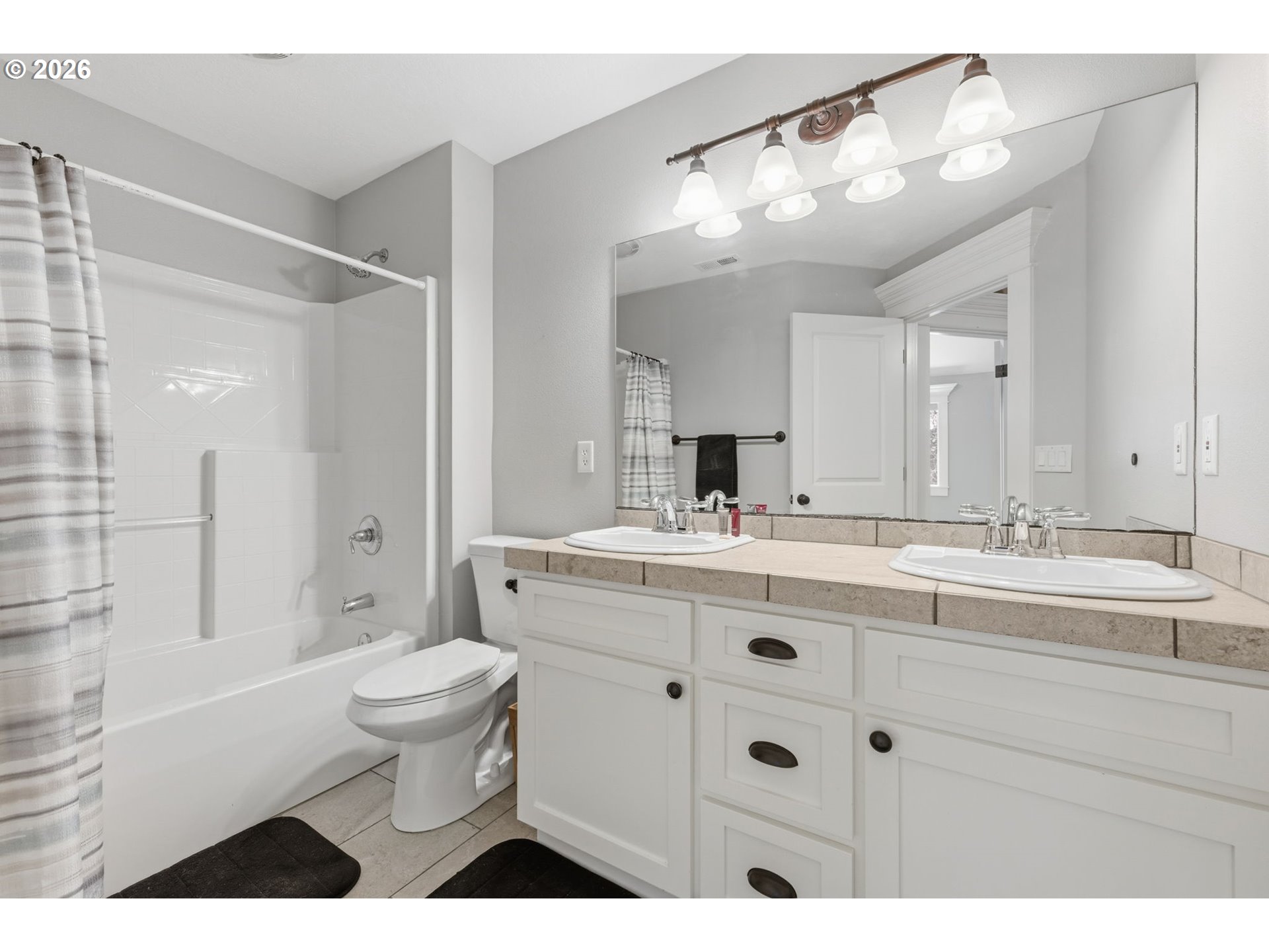 475 Salty Way Eugene, OR 97404 - Photo 43 of 48 a bathroom with a sink a toilet a large mirror and shower