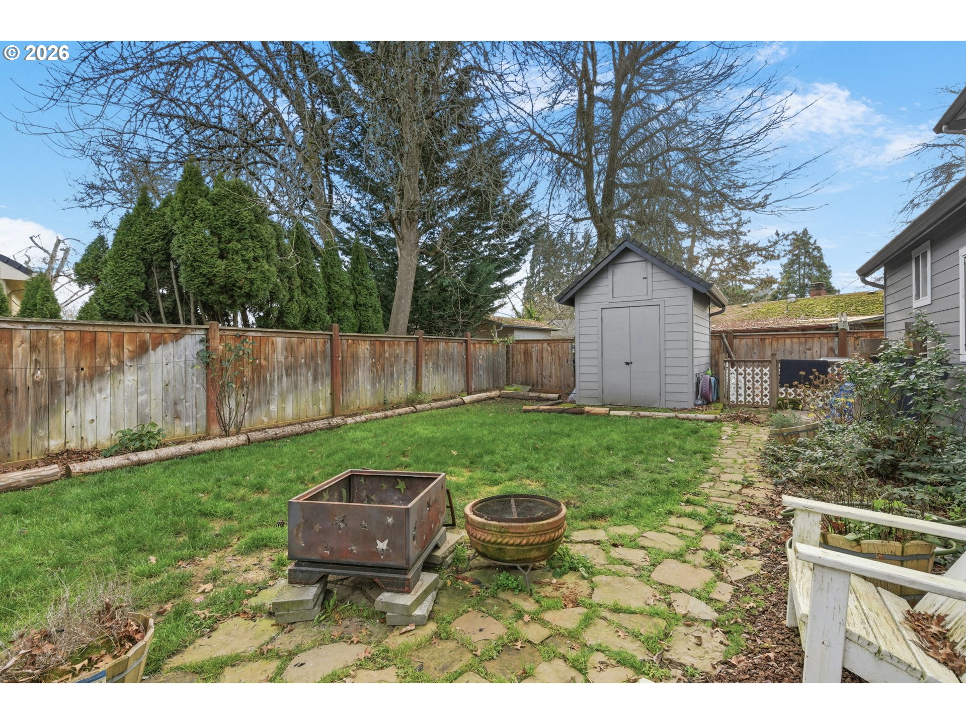 475 Salty Way Eugene, OR 97404 - Photo 46 of 48 a view of a backyard with table and chairs with wooden fence