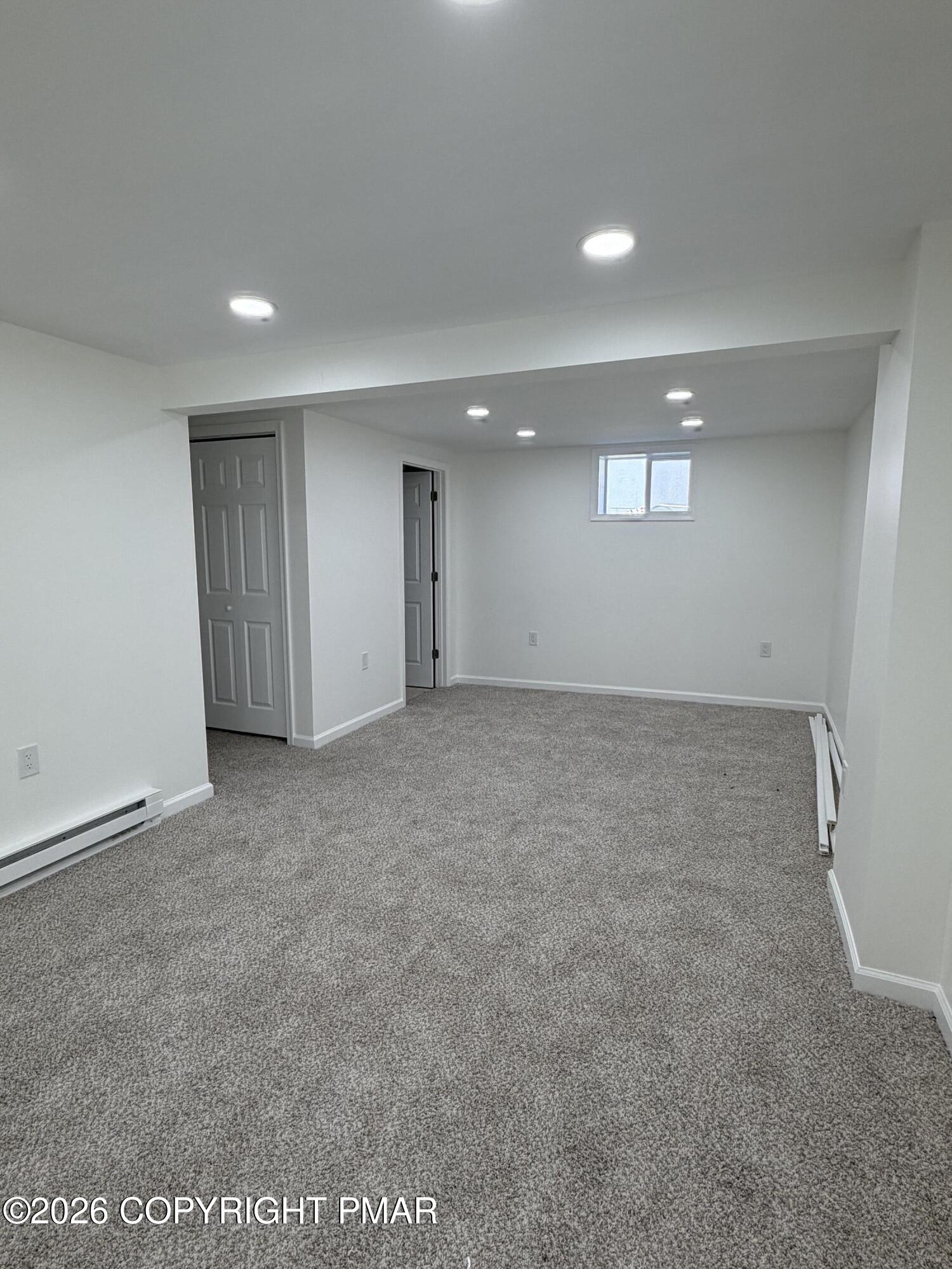 108 Spruce Lane, Unit 108 Bushkill, PA 18324 - Photo 10 of 12 Basement Living Area