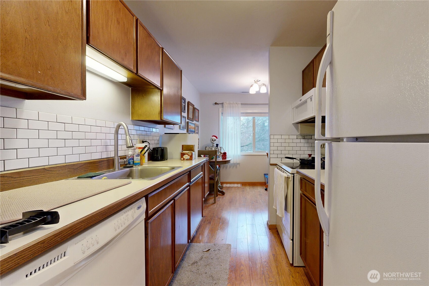 364 Catherine Street, Unit B6 Walla Walla, WA 99362 - Photo 16 of 26 a kitchen with stainless steel appliances a sink a stove top oven a counter space and cabinets