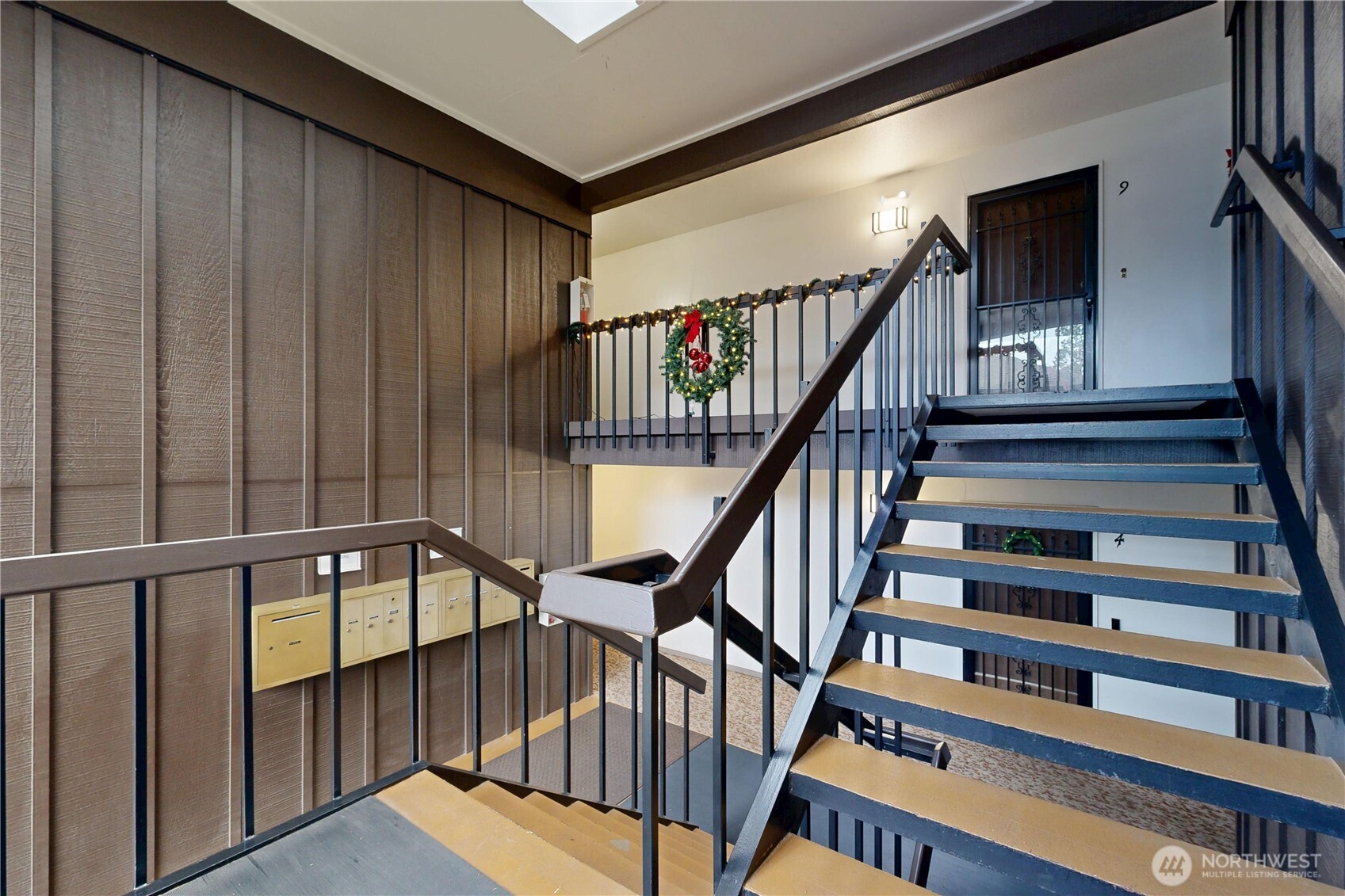 364 Catherine Street, Unit B6 Walla Walla, WA 99362 - Photo 3 of 26 a view of staircase with lots of frames on wall and a window