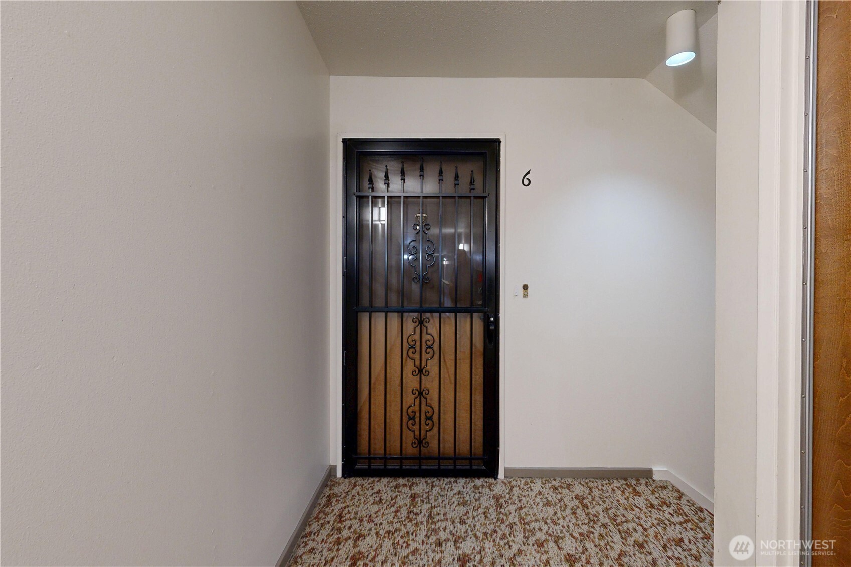 364 Catherine Street, Unit B6 Walla Walla, WA 99362 - Photo 4 of 26 a view of a hallway with wooden floor and a bathroom