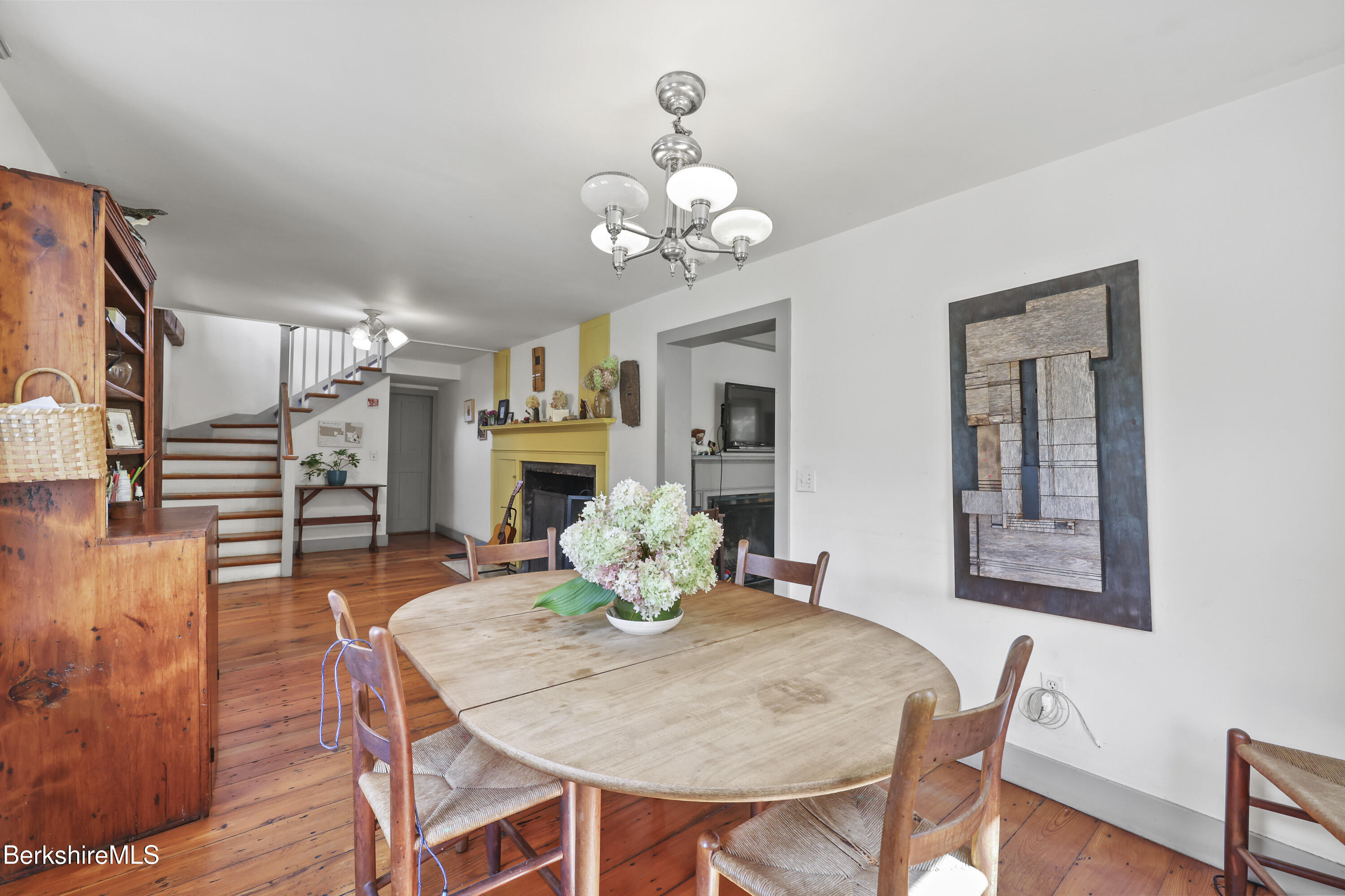 276 Great Barrington Road West Stockbridge, MA 01236 - Photo 12 of 68 a view of a dining room with furniture wooden floor and chandelier