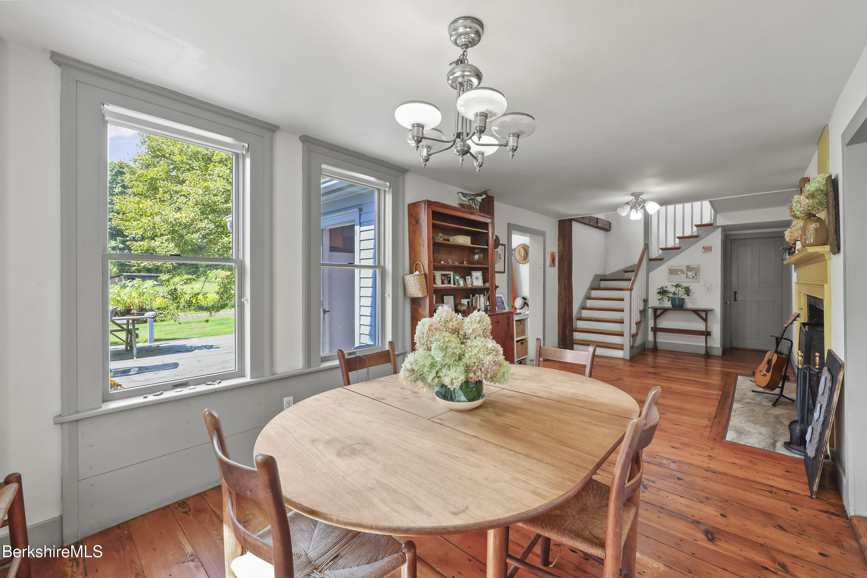 276 Great Barrington Road West Stockbridge, MA 01236 - Photo 13 of 68 a dining room with furniture a large window and wooden floor