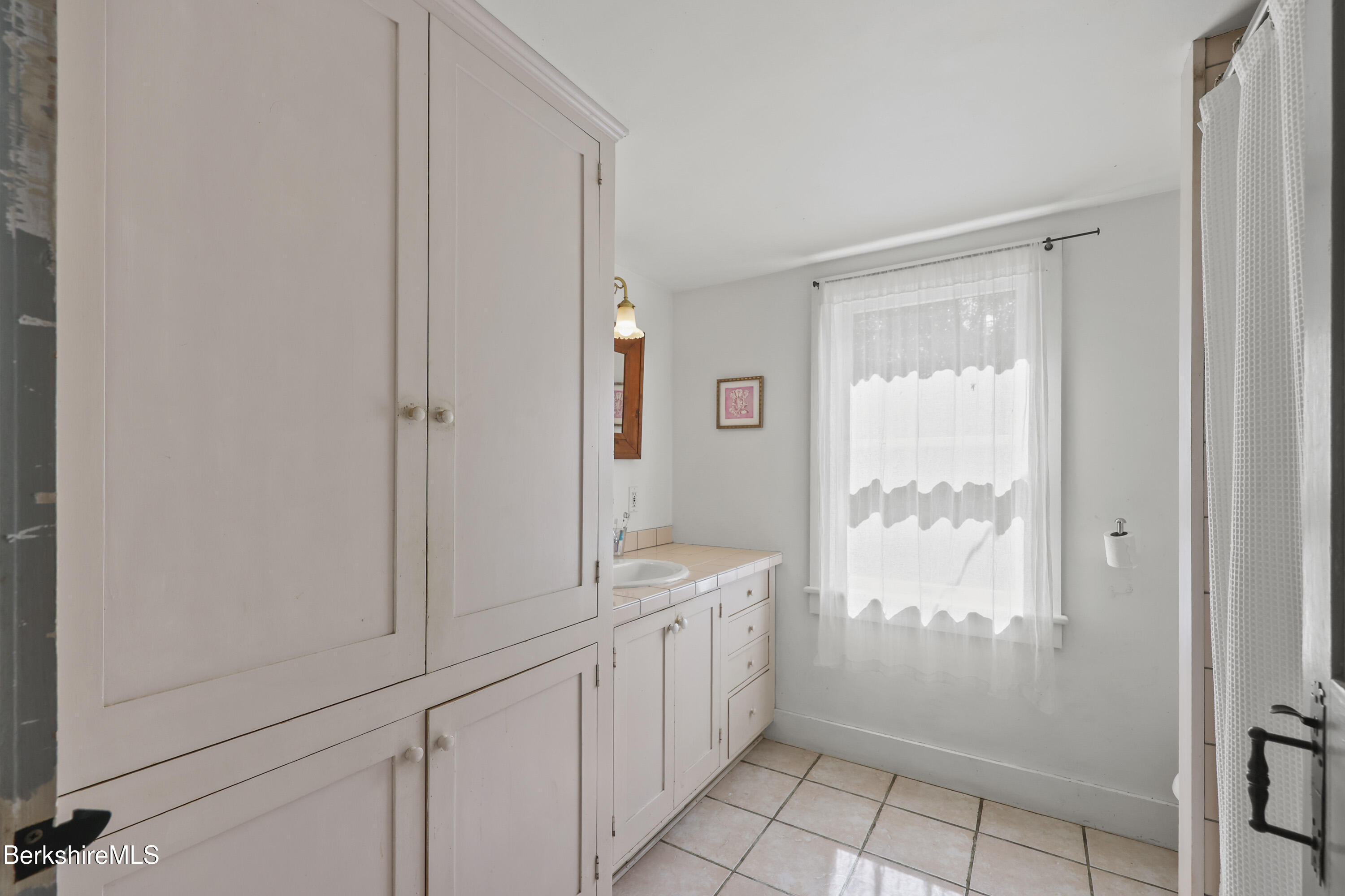 276 Great Barrington Road West Stockbridge, MA 01236 - Photo 34 of 68 a bathroom with a granite countertop sink a mirror and a shower