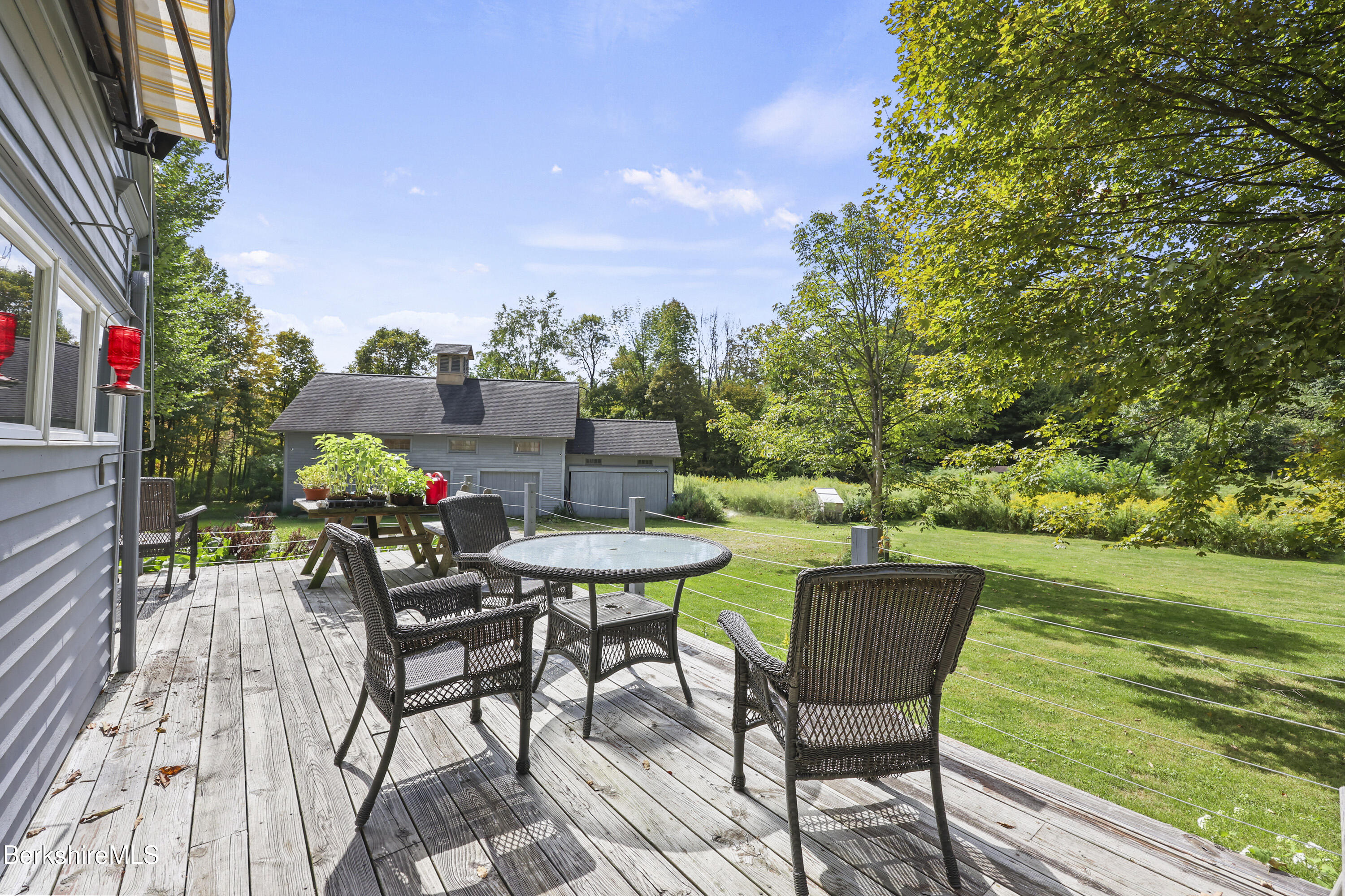276 Great Barrington Road West Stockbridge, MA 01236 - Photo 44 of 68 a view of a chairs and table in patio with a yard