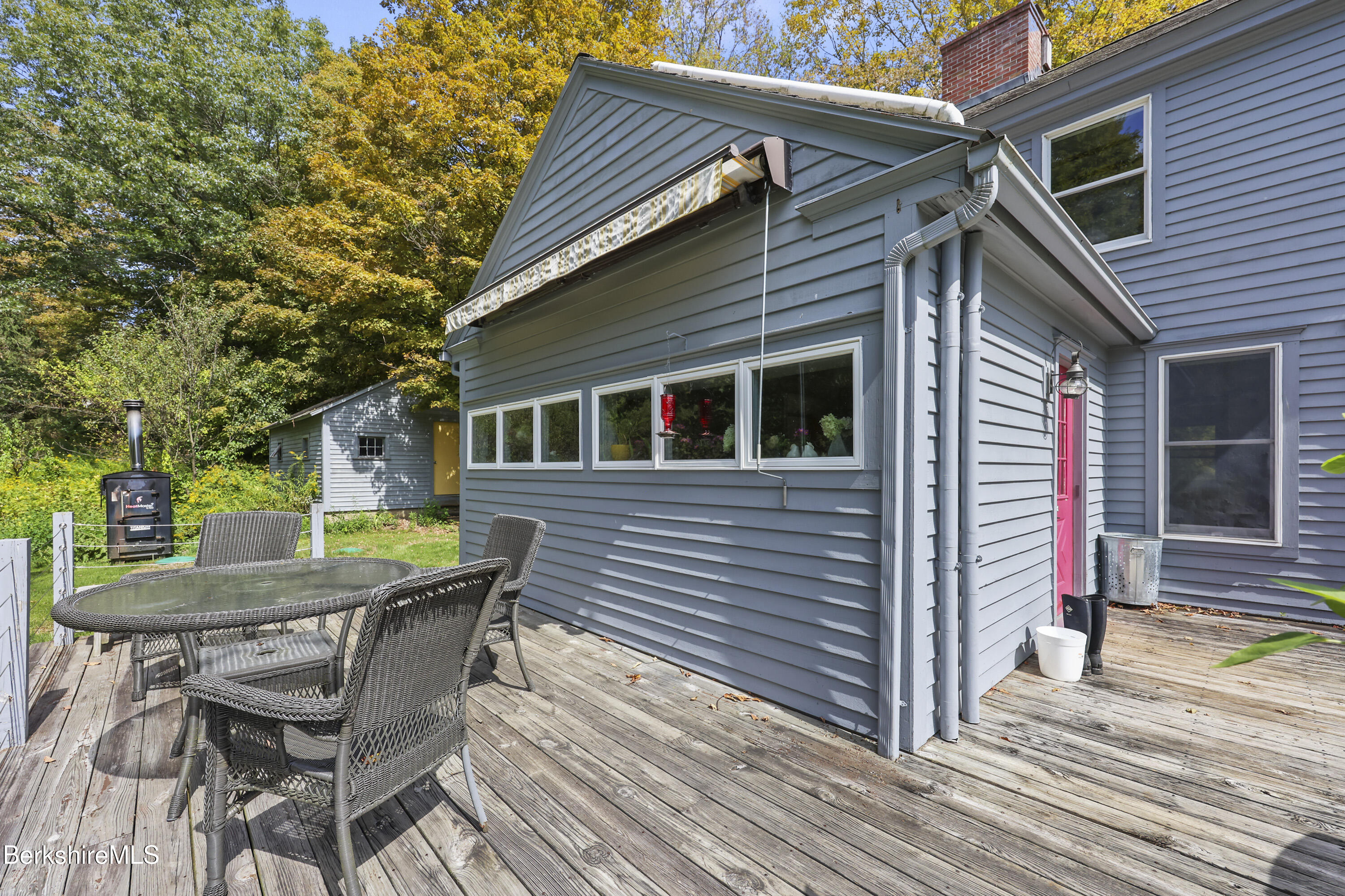 276 Great Barrington Road West Stockbridge, MA 01236 - Photo 45 of 68 a backyard of a house with barbeque oven and seating space