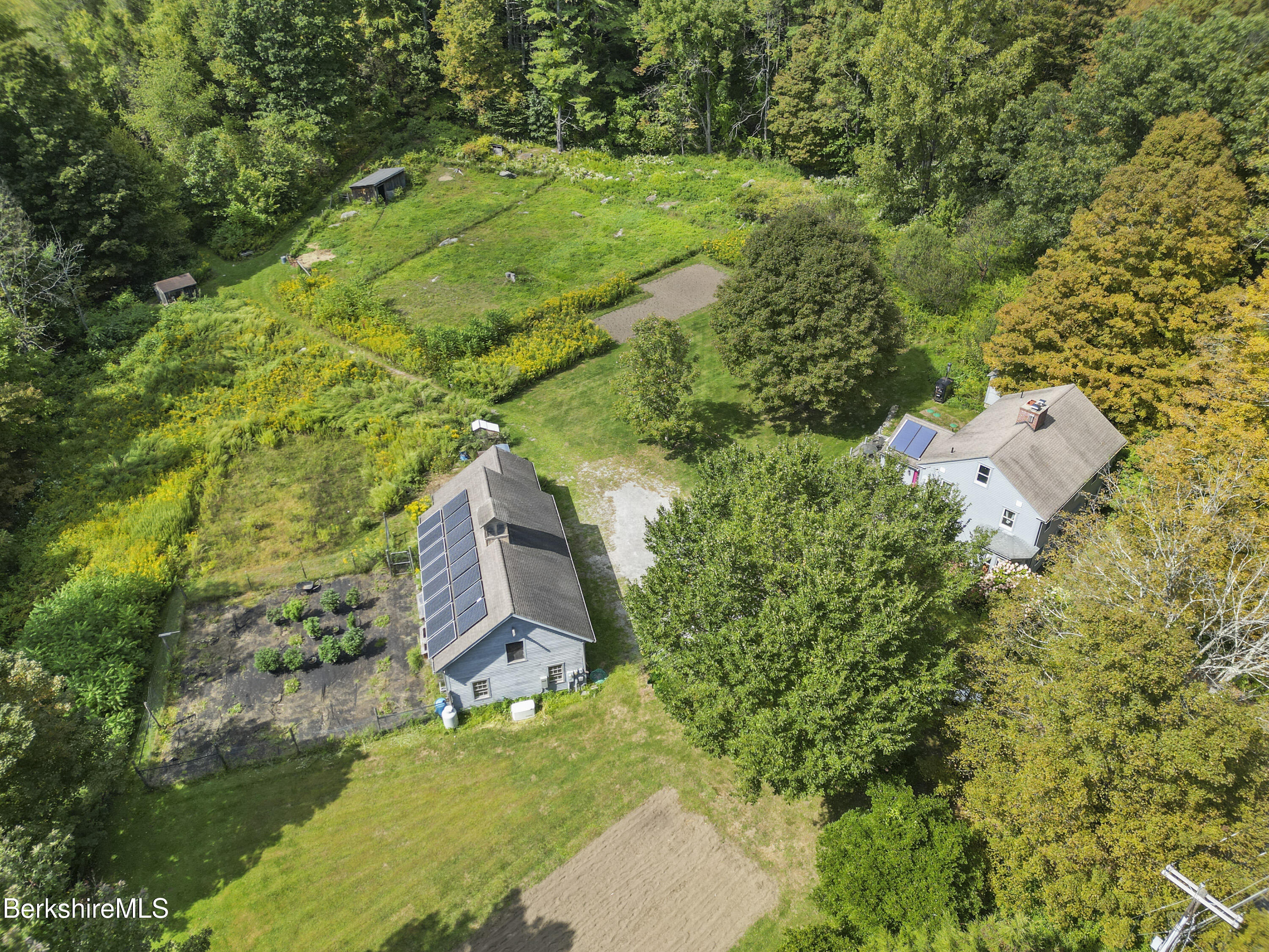 276 Great Barrington Road West Stockbridge, MA 01236 - Photo 61 of 68 an aerial view of residential house with outdoor space and trees all around