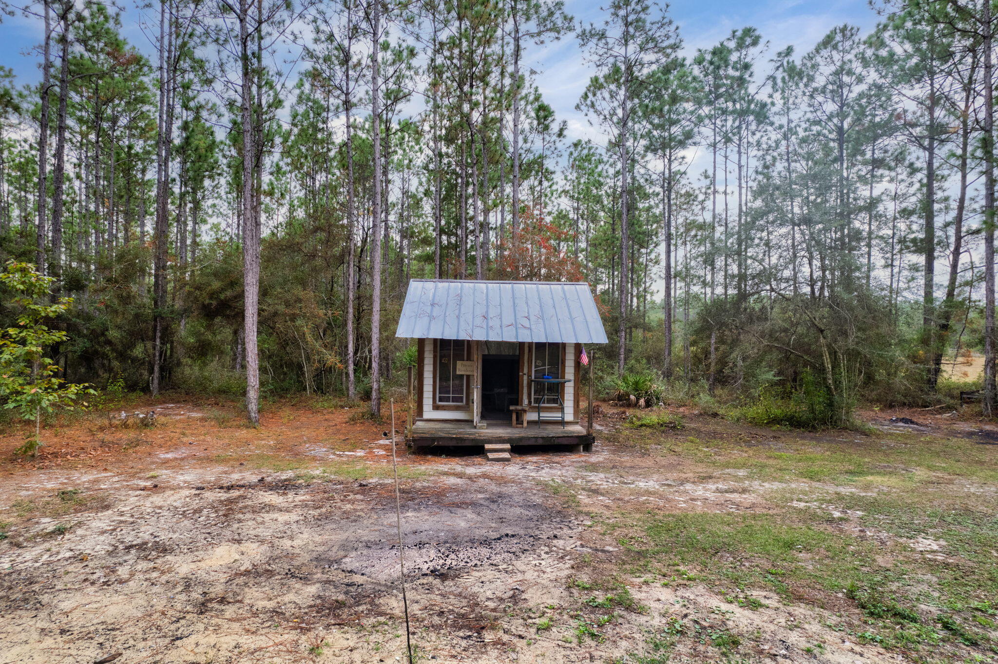 526 Don Graff Road Freeport, FL 32439 - Photo 10 of 20 a front view of a house with a garden
