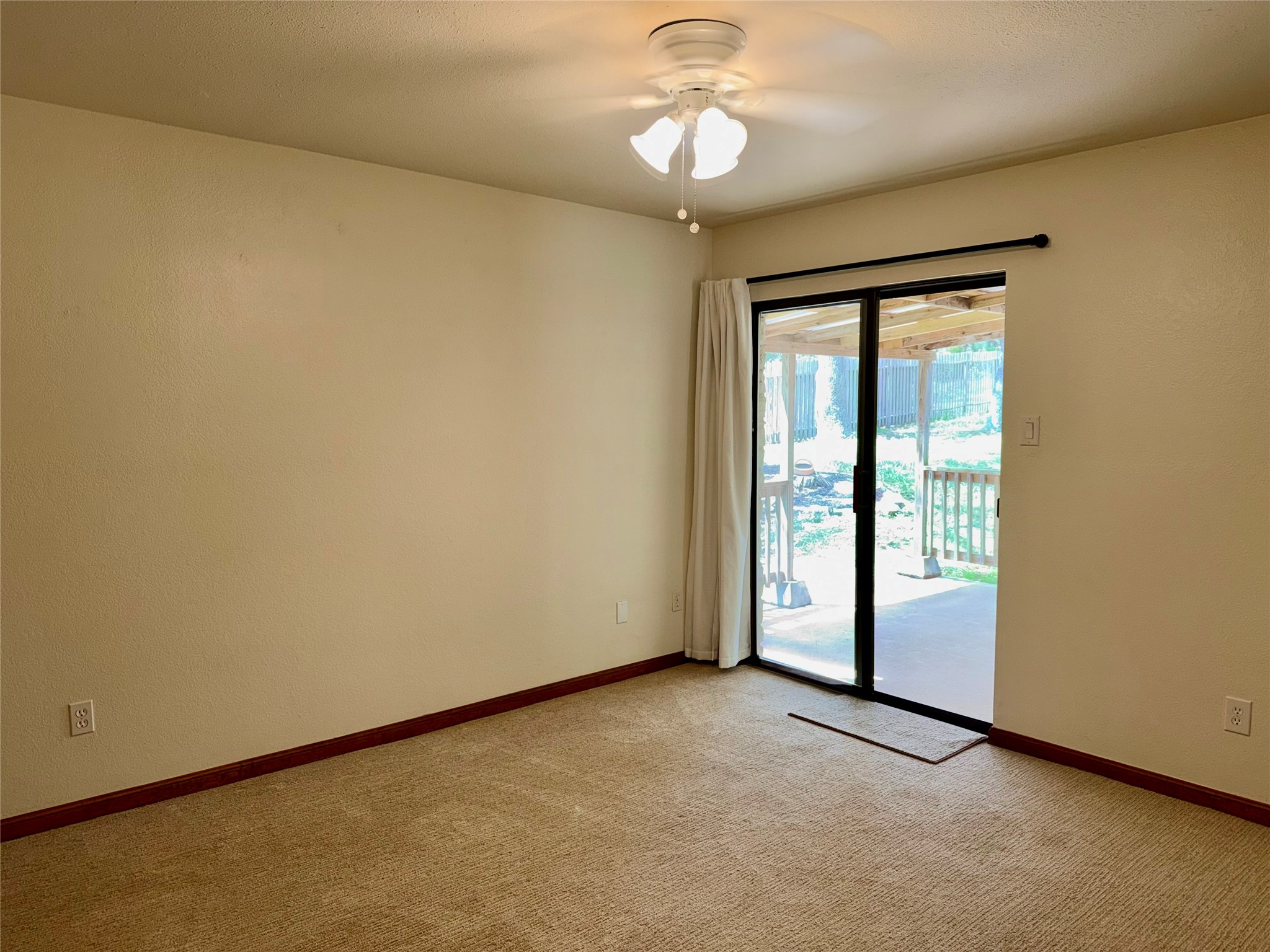 349 Fantail Loop, Unit B Austin, TX 78734 - Photo 3 of 9 an empty room with a empty space and a ceiling fan