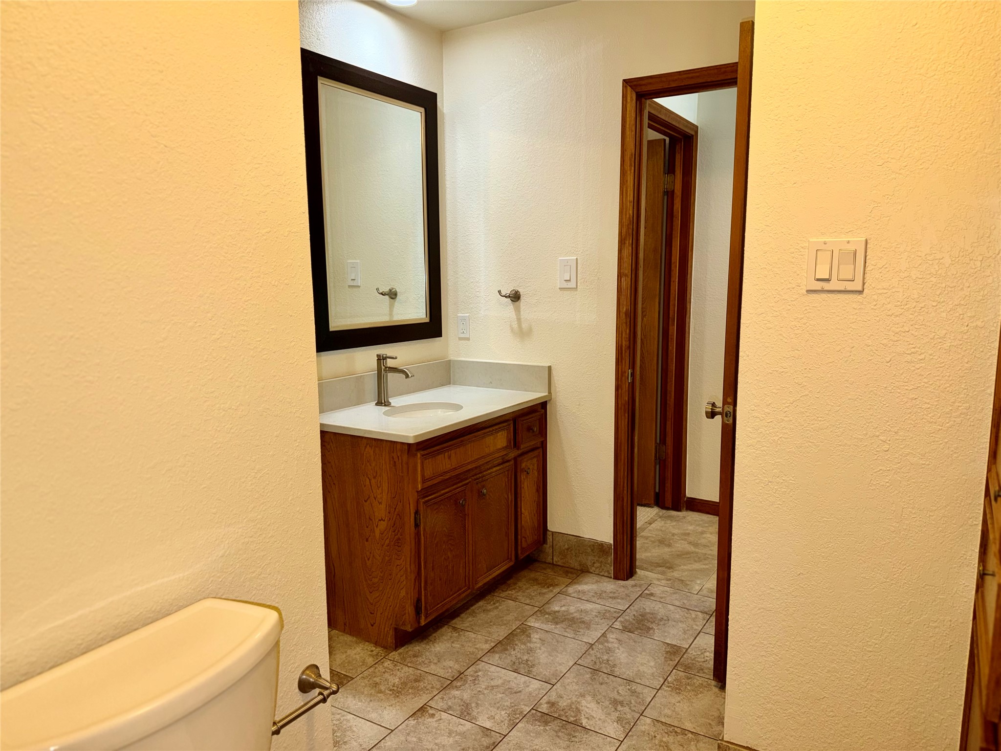 349 Fantail Loop, Unit B Austin, TX 78734 - Photo 4 of 9 a bathroom with a sink a toilet and shower