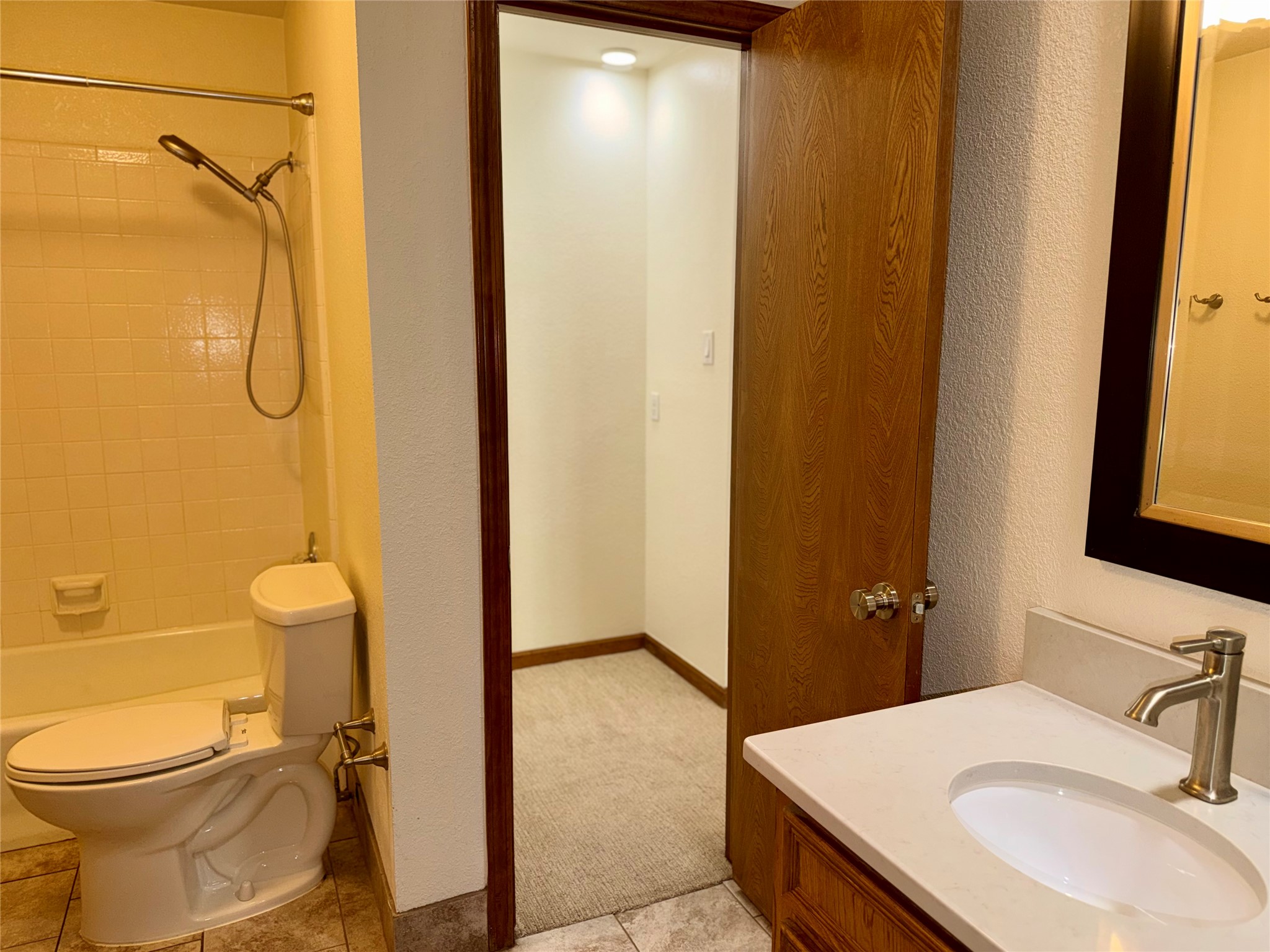 349 Fantail Loop, Unit B Austin, TX 78734 - Photo 5 of 9 a bathroom with a sink toilet and shower