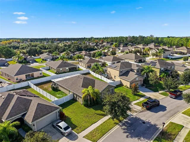 an aerial view of a pool patio swimming pool and mountain view