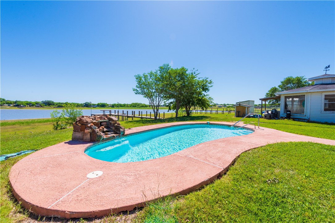 132 Zenna Drive Mathis, TX 78368 - Photo 33 of 40 a view of a house with swimming pool and yard